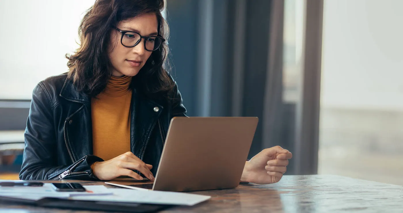 Asian woman working laptop at office.
