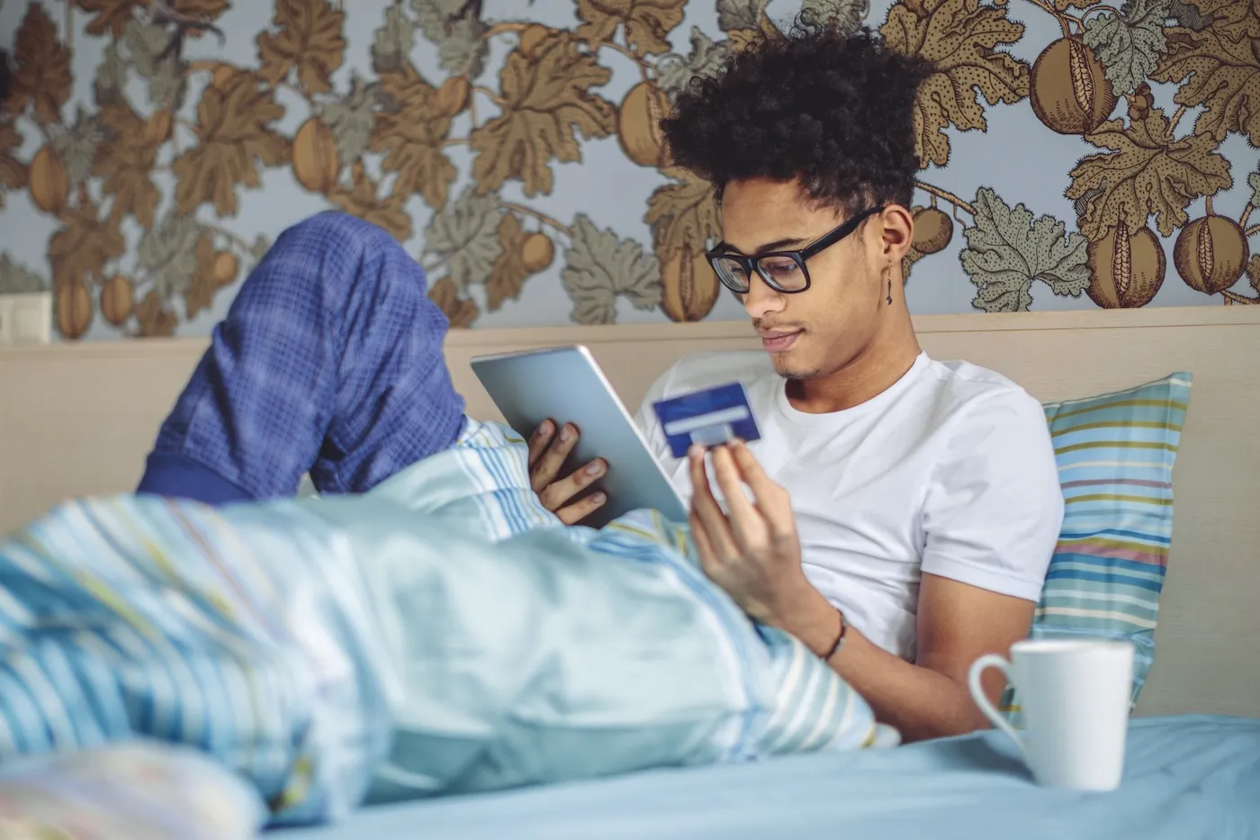 Young man researching cash advances at home.