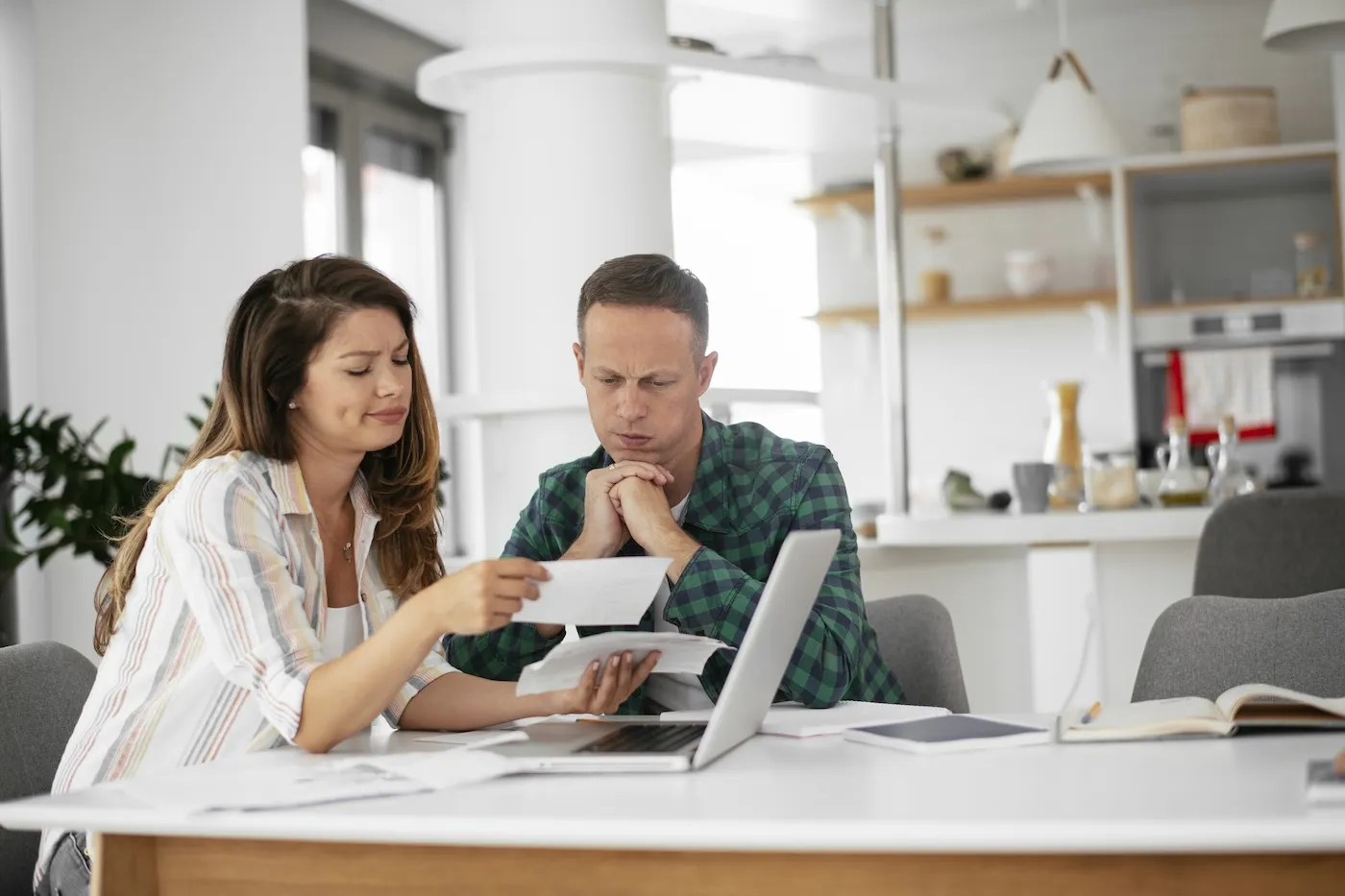 Husband and wife preparing bills to pay. Young couple having financial problems