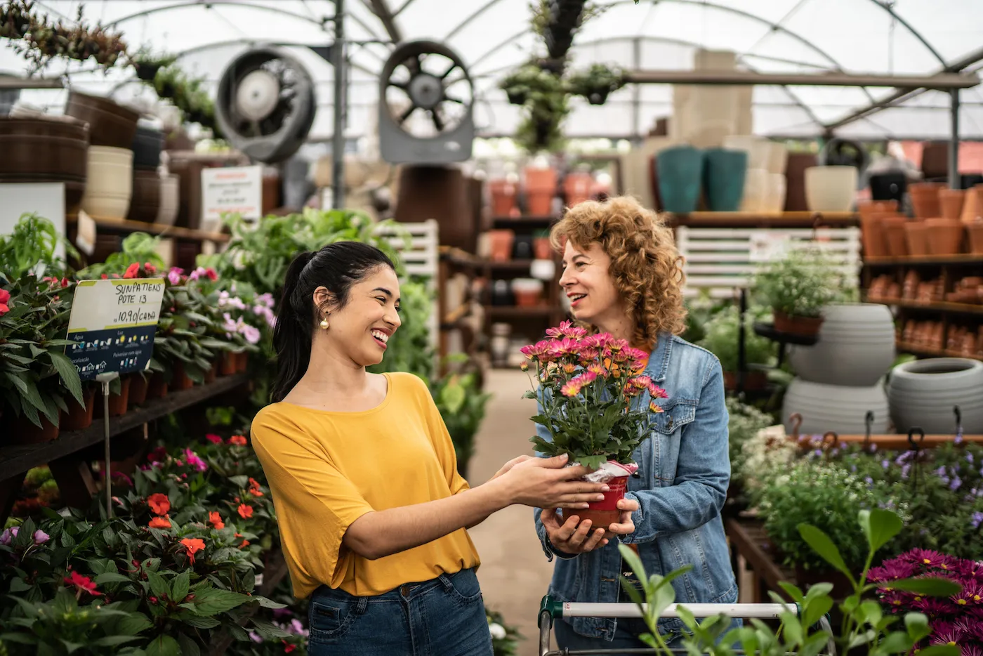 Friends buying plants at a garden center