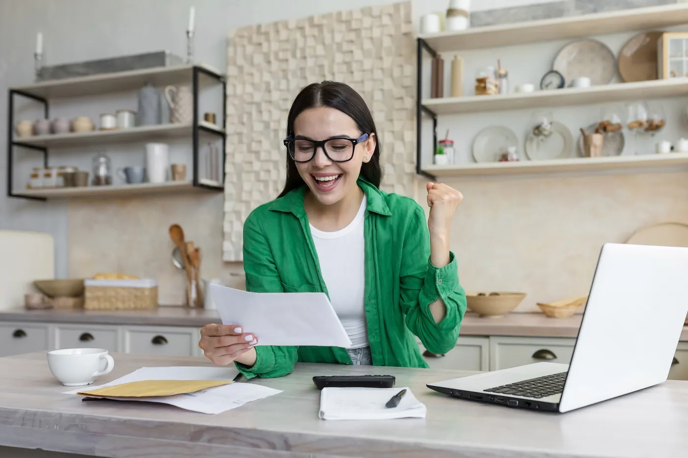 Young woman receiving good financial news.